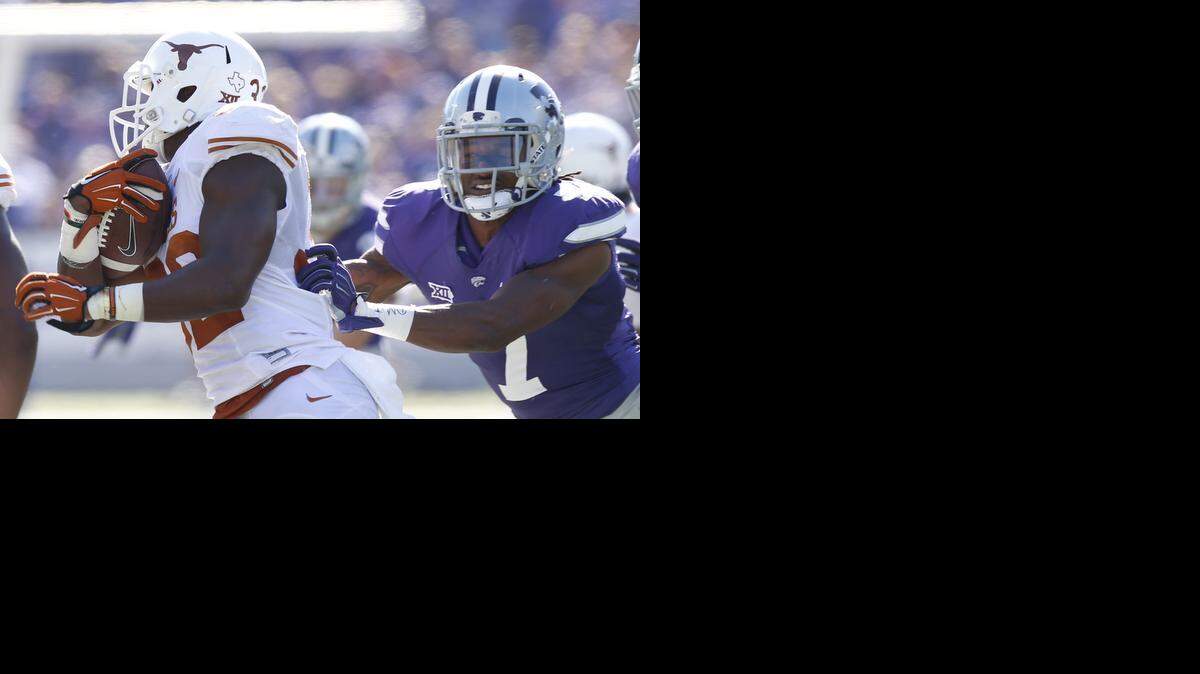 
K-State defensive back Danzel McDaniel (7) tries to stop Texas running back Johnathan Gray.
