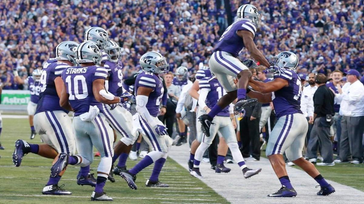K-State defensive back DJ Reed (2) celebrates his interception and touchdown against Texas Tech.