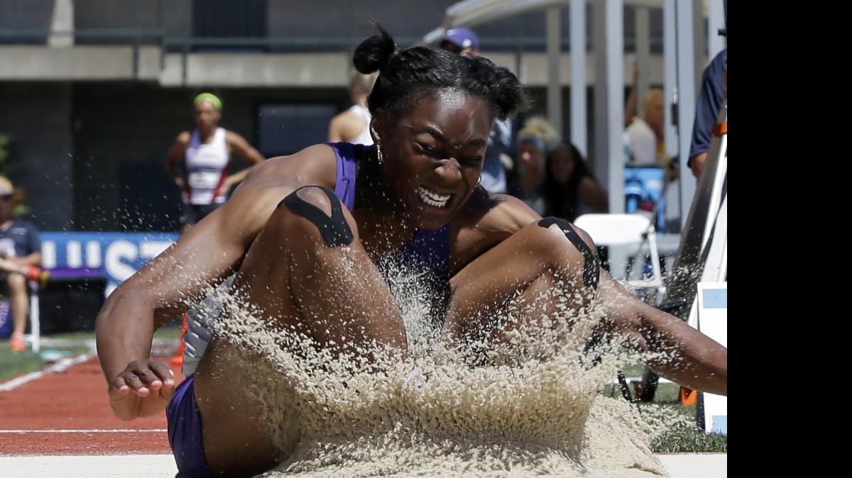 
Kansas State's Akela Jones lands in the sand pit during the long jump event of the heptathlon competition at the NCAA track and field championships in Eugene, Ore., last week (June 11, 2015) 
