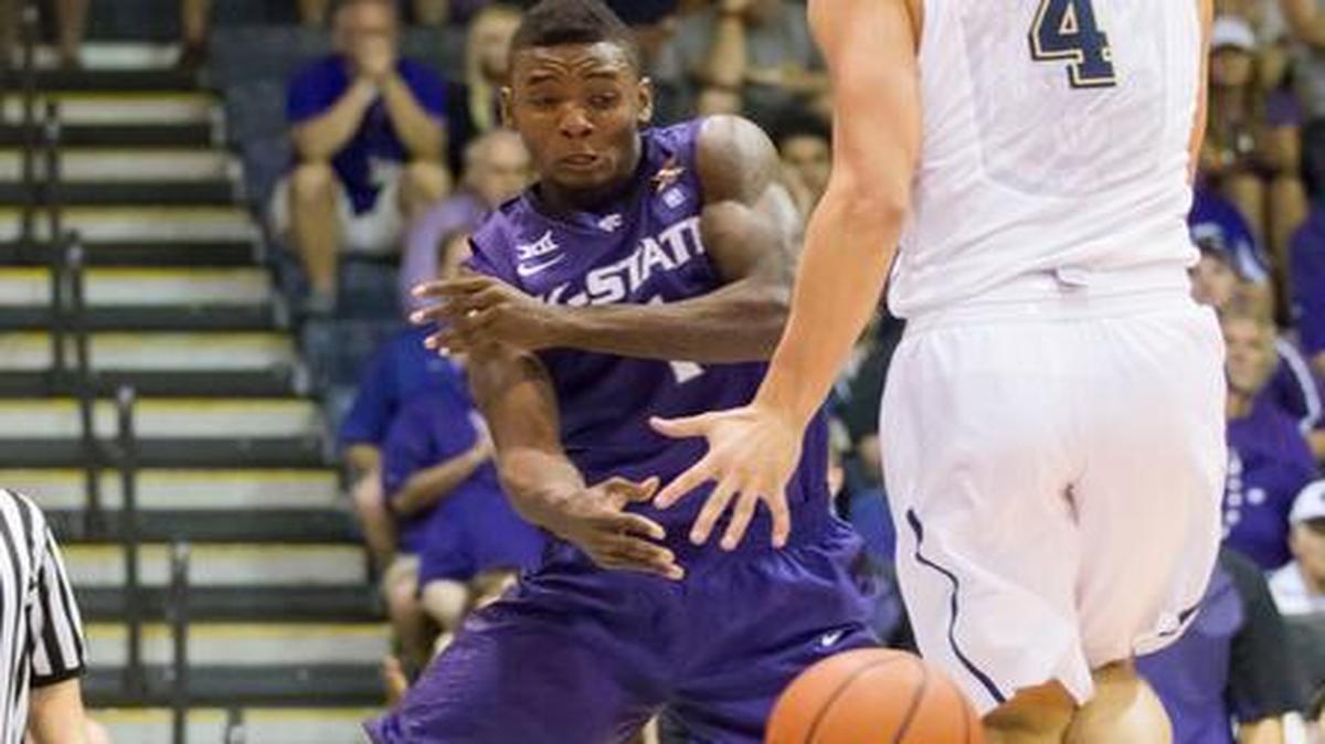 
Kansas State guard Jevon Thomas passes while being defended by Pittsburgh forward Ryan Luther in the first half Wednesday at the Maui Invitational in Lahaina, Hawaii. 
