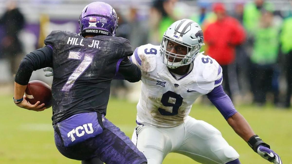 K-State linebacker Elijah Lee sizes up TCU quarterback Kenny Hill before making the tackle. (December 3, 2016)