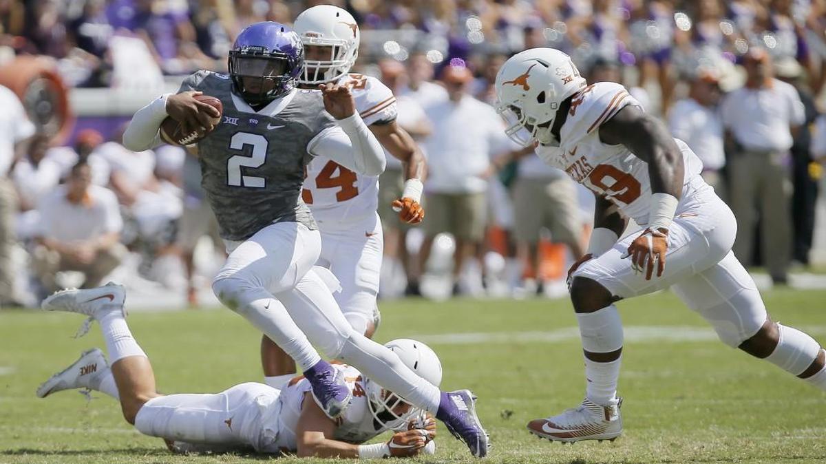 
TCU quarterback Trevone Boykin beats three Texas defenders. 
