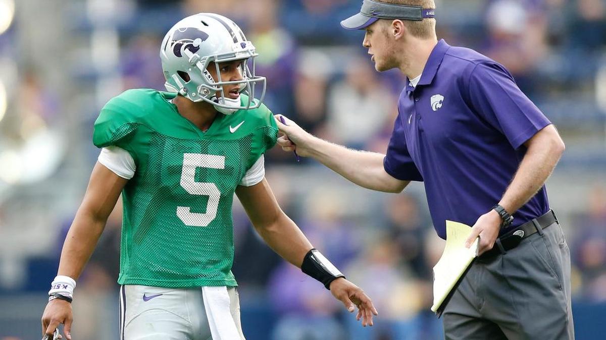 
Freshman quarterback Alex Delton gets some words from graduate assistant coach Collin Klein at Kansas State’s spring game in April.
