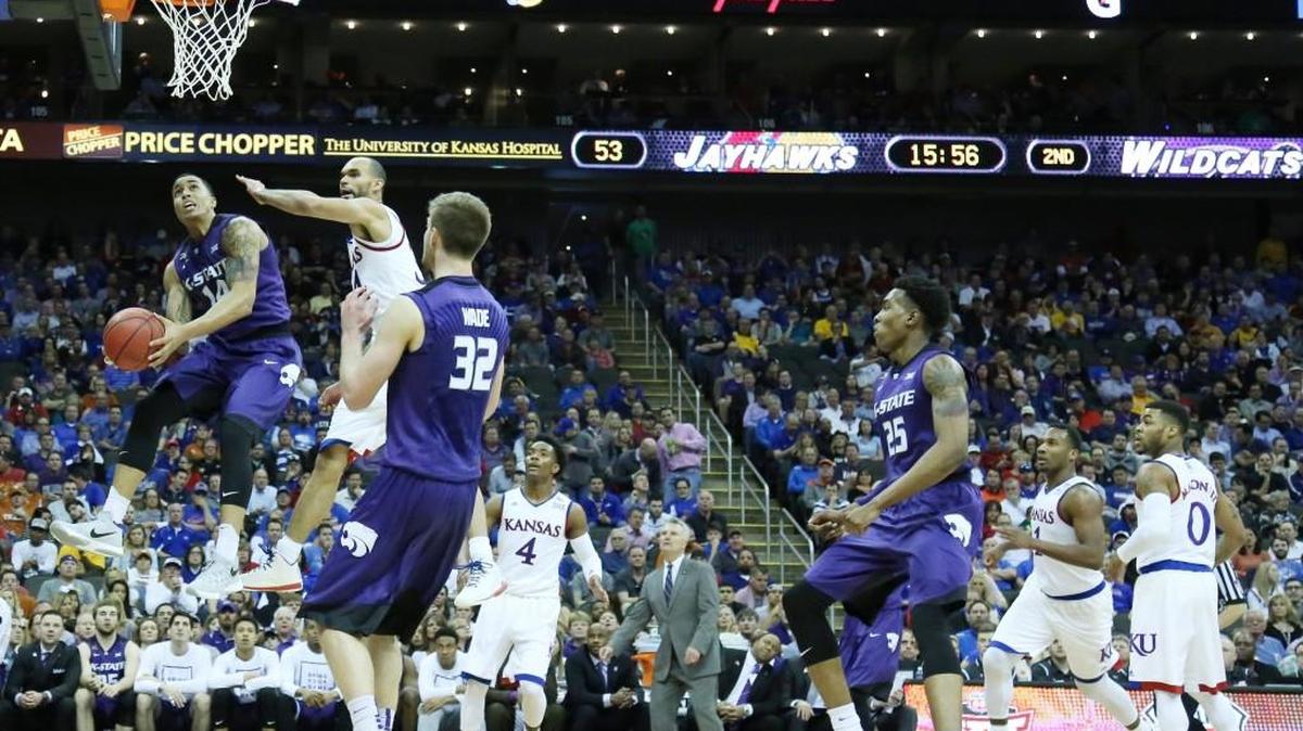 Kansas forward Perry Ellis defends as K-State guard Justin Edwards tries to make a shot Thursday afternoon in the quarterfinal round of the 2016 Big 12 Men's Basketball Championship in the Sprint Center. (March 10, 2016)