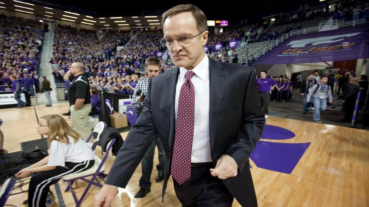 Oklahoma coach Lon Kruger, a former Kansas State player and coach enters the court at Bramlage Coliseum. (Jan. 28, 2012)