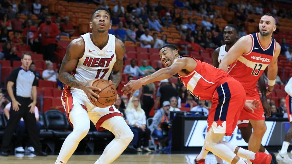Miami Heat guard Rodney McGruder looks to score as Washington Wizards forward Otto Porter Jr. (22) defends in the first quarter as the Miami Heat host the Washington Wizards at the AmericanAirlines Arena on Wednesday, October 11, 2017.