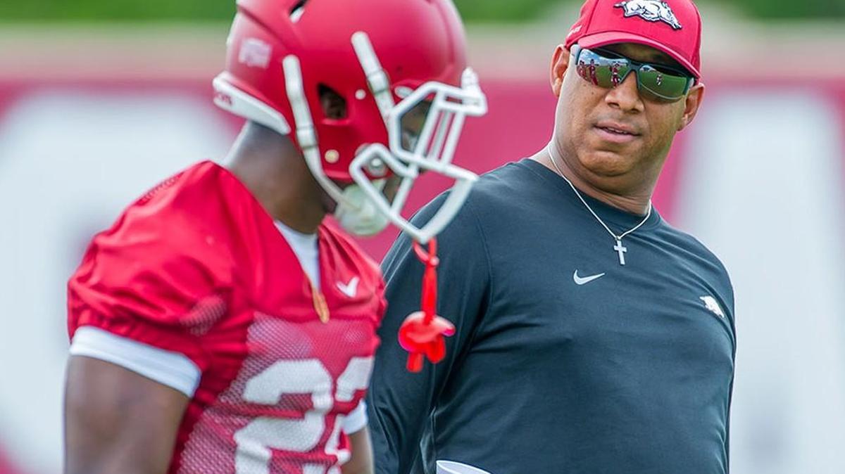 Arkansas receivers coach Michael Smith, right, is in his fourth year on the Razorbacks’ staff after being a part of the K-State program since 1988.