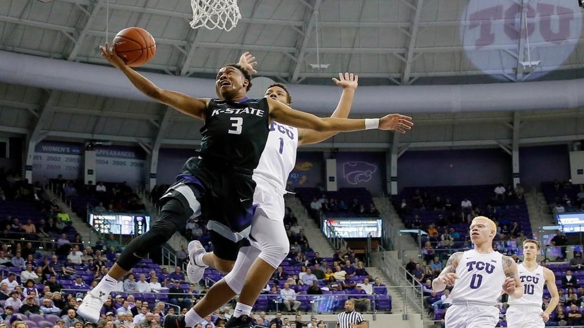 Kansas State's Kamau Stokes goes up for a shot after getting past TCU's Desmond Bane in the first half Wednesday in Fort Worth.