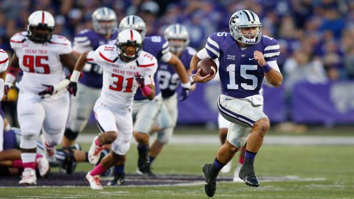 
Kansas State quarterback Jake Waters takes off on a 50-yard run against Texas Tech on Saturday night in Manhattan.
