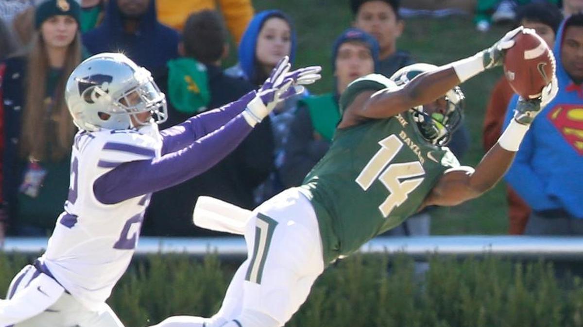 Baylor wide receiver Chris Platt grabs a pass from Baylor quarterback Zach Smith in the final seconds of the first half Saturday in Waco. K-State defensive back Dante Barnett defended on the play. (November 19, 2016)