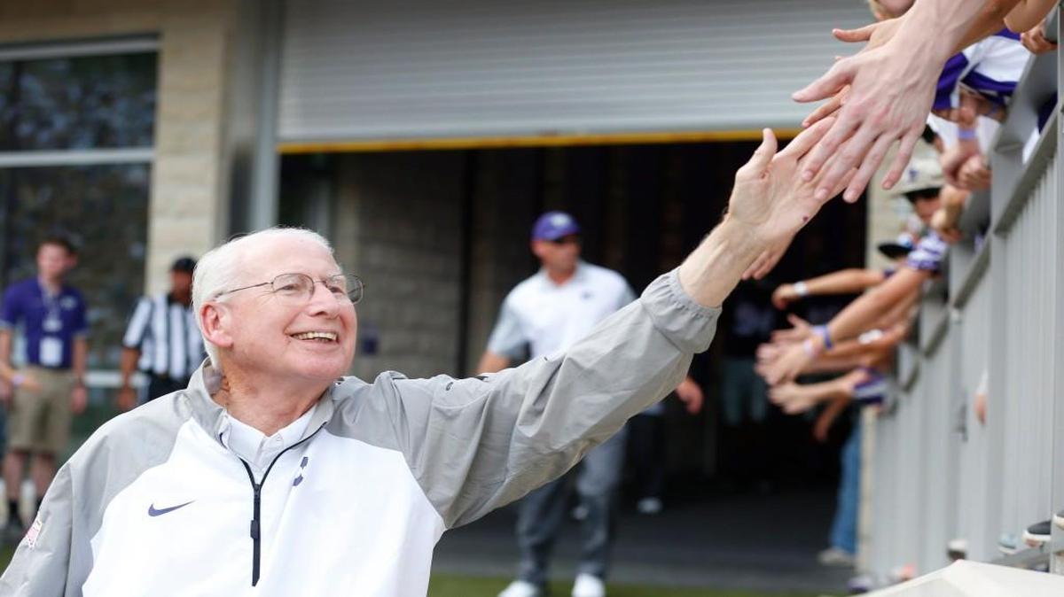 K-State coach Bill Snyder "high fives" young fans on this way to the field Saturday night in Manhattan. Snyder will be inducted into the College Football Hall of Fame this winter. (September 05, 2015)