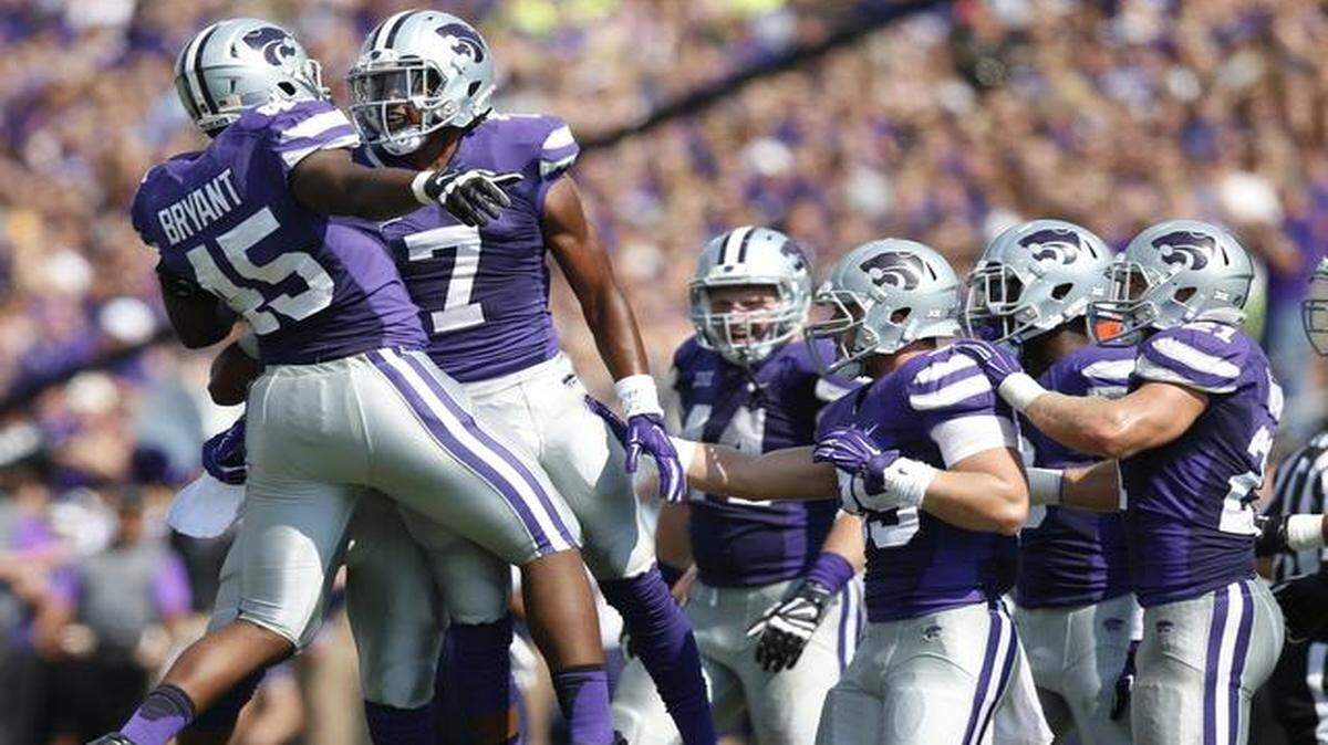
K-State defensive end Marquel Bryant (45) and defensive back Danzel McDaniel (7) celebrate a defensive play against UTEP on Saturday in Manhattan.
