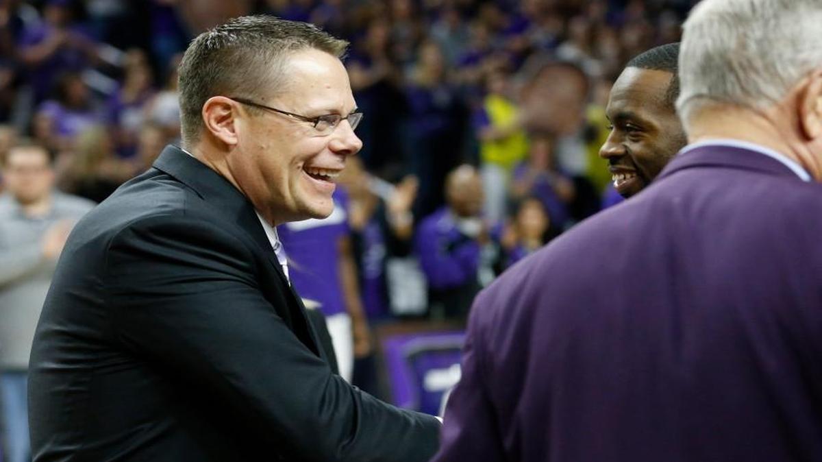Kansas State deputy athletic director Laird Veatch congratulates men’s basketball players on senior day March 4 at Bramlage Coliseum.