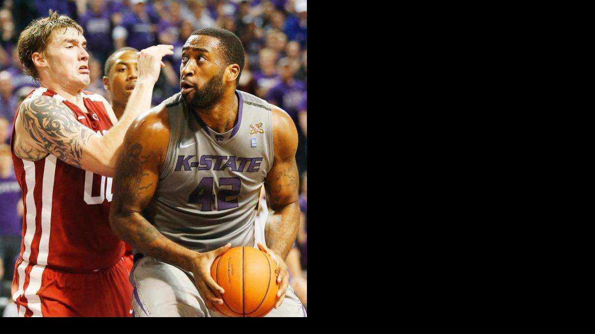 
K-State forward Thomas Gipson (42) is pressured by Oklahoma's Ryan Spangler under the basket during January’s game at Bramlage Coliseum.
