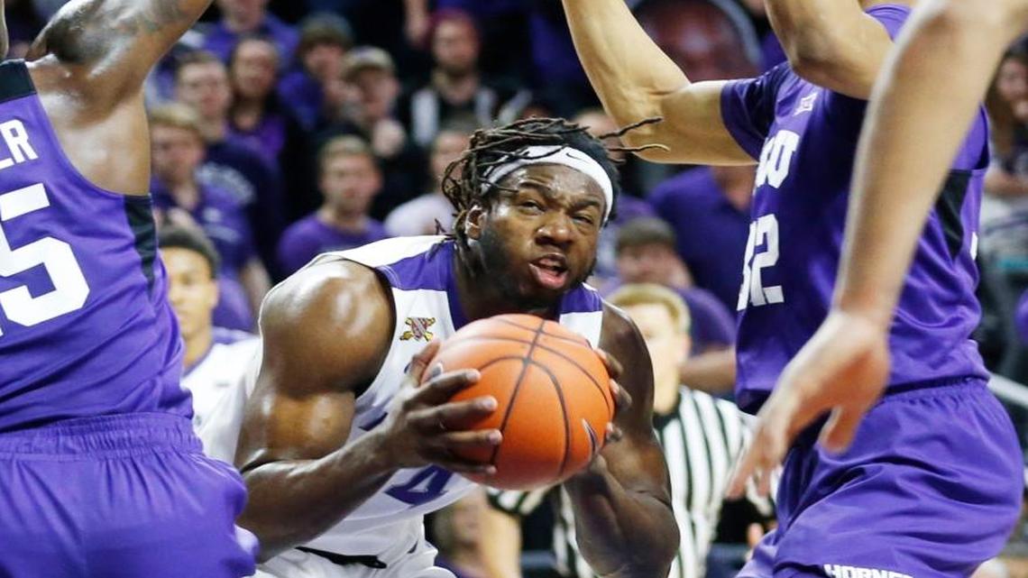 K-State forward D.J. Johnson looks for a route the basket against TCU last season.