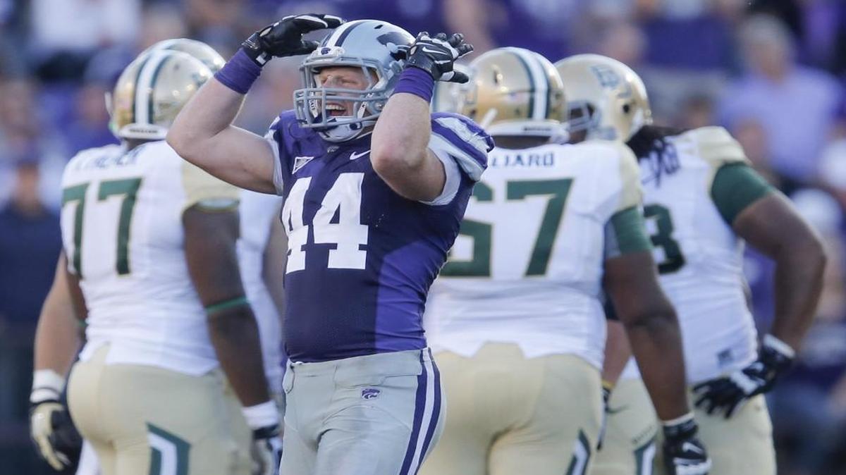 Kansas State's Ryan Mueller fires up the crowd during the fourth quarter at Bill Snyder Family Stadium in Manhattan.