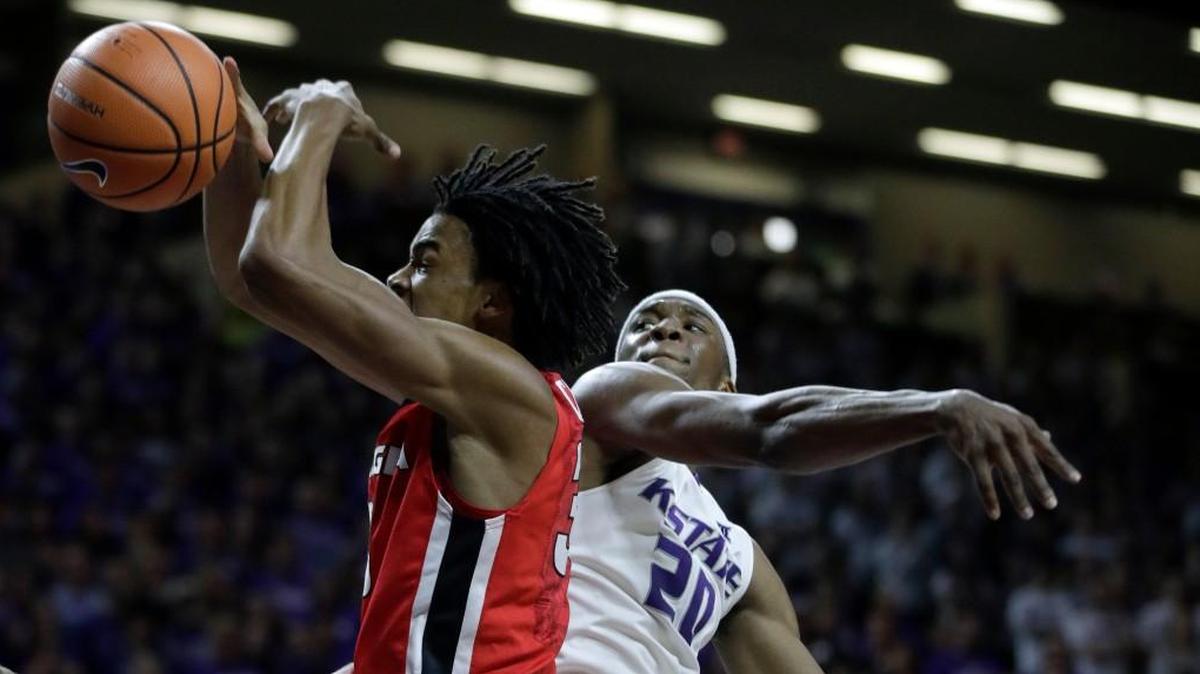 Kansas State forward Xavier Sneed, right, blocks a shot by Georgia forward Nicolas Claxton during the first half Saturday in Manhattan.