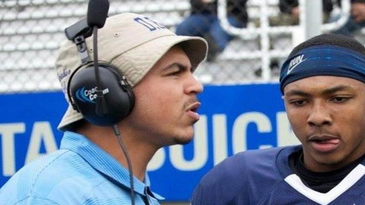 
New Kansas State quarterback Jonathan Banks spends a moment with his position coach at Contra Costa College. 
