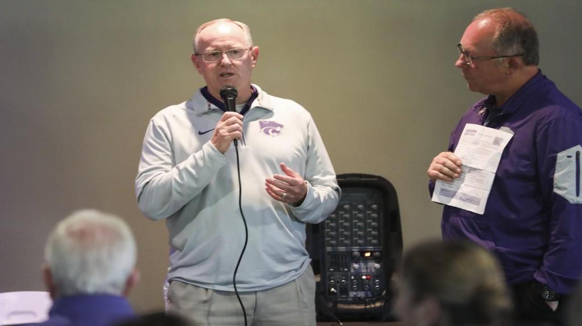 Kansas State's new athletic director Gene Taylor speaks to a crowd of supporters during the Catbackers stop Tuesday at Tanganyika Wildlife Park.