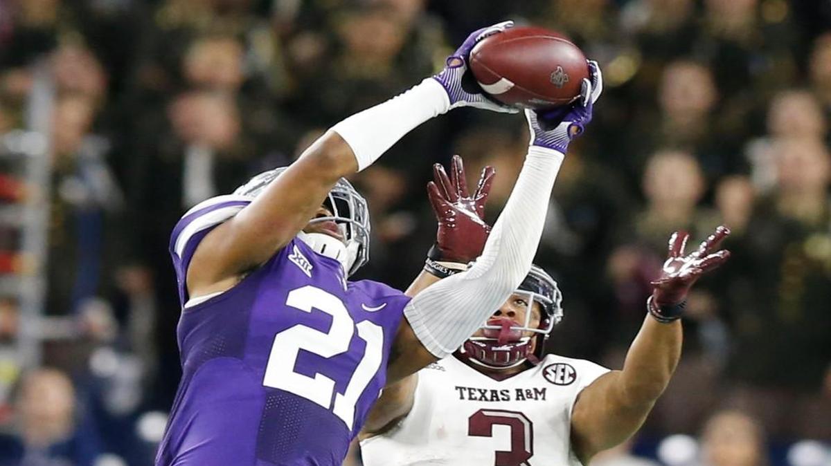 K-State defensive back Kendall Adams (21) grabs a pass intended for Texas A&M wide receiver Christian Kirk (3) Wednesday night in the Texas Bowl.