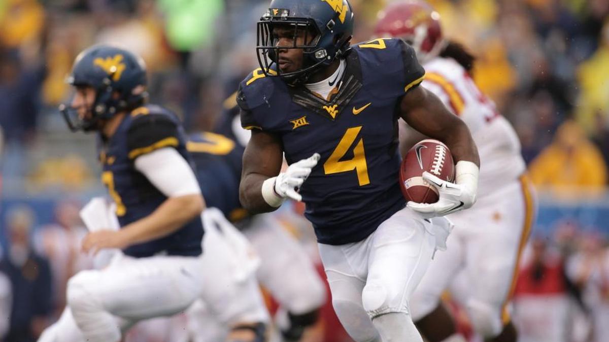 West Virginia running back Wendell Smallwood carries the ball last Saturday against Iowa State. The Mountaineers have won four in a row.