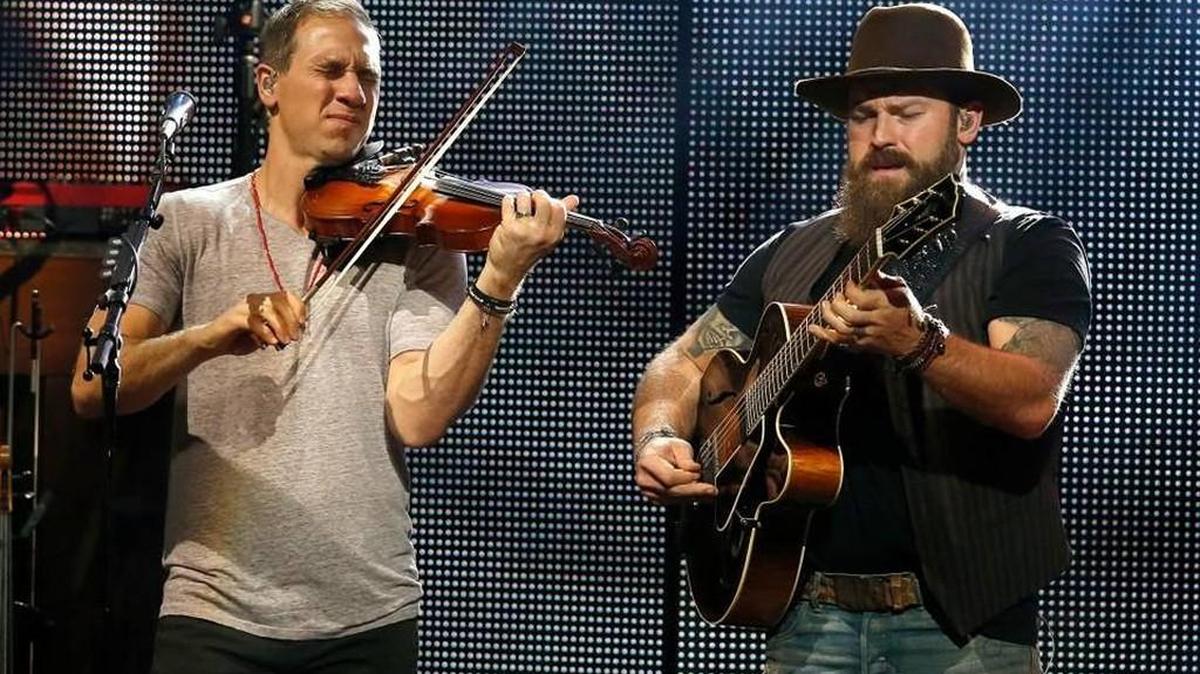 Jimmy De Martini, left, and Zac Brown of the Zac Brown Band perform in Phoenix last October.
