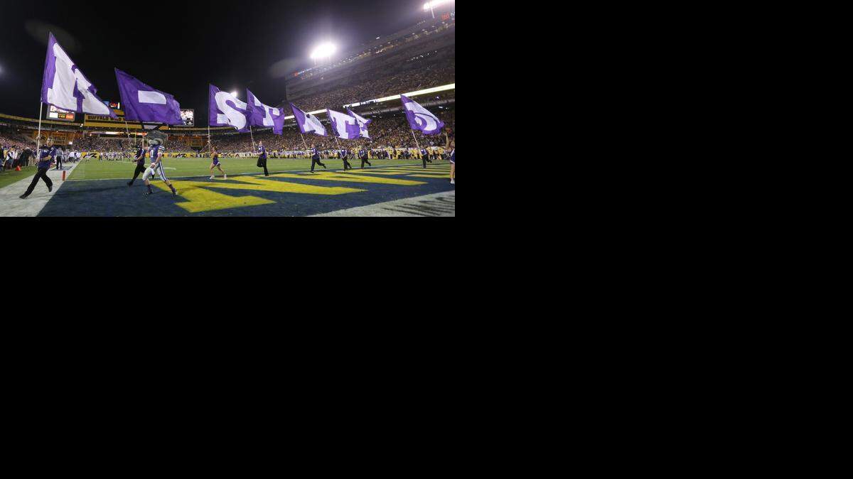 
The K-State cheer squad celebrates after a K-State touchdown at the Buffalo Wild Wings Bowl(December 28, 2013)
