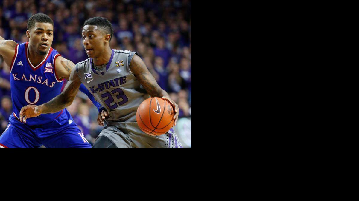 
K-State guard Nigel Johnson led K-State with 20 points Monday night. Kansas guard Frank Mason III (0) defends as Johnson drives for the basket.(February 23, 2015)
