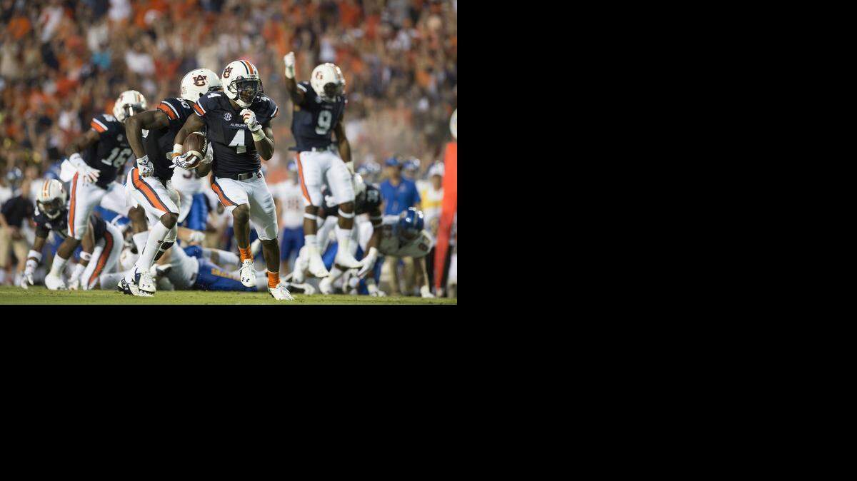 
Auburn receiver Quan Bray (4) returns a punt against San Jose State. (AP Photo/The Montgomery Advertiser, Albert Cesare)
