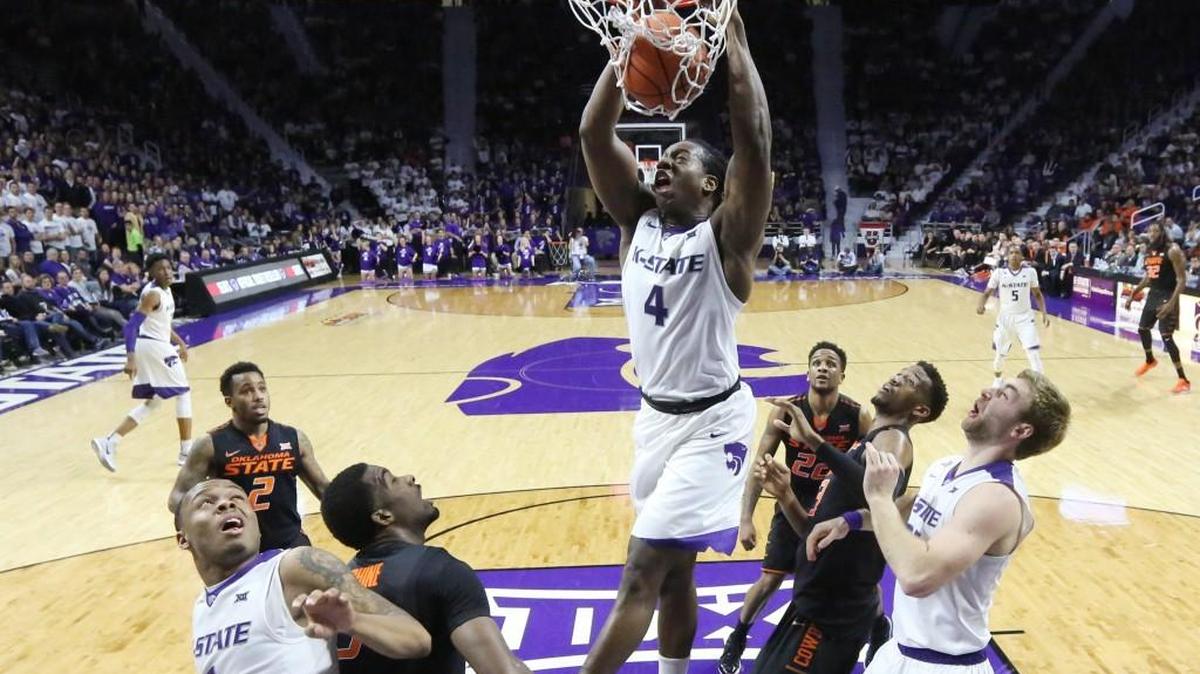 K-State DJ Johnson slams in a dunk in the 2nd half Saturday evening in Bramlage Coliseum as the Wildcats defeated Oklahoma State 89-73. (Bo Rader, The Wichita Eagle)