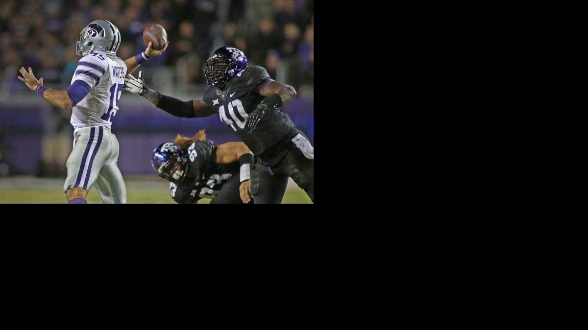 
Kansas State quarterback Jake Waters comes under pressure from TCU defensive end James McFarland. (Paul Moseley/Fort Worth Star-Telegram/MCT)
