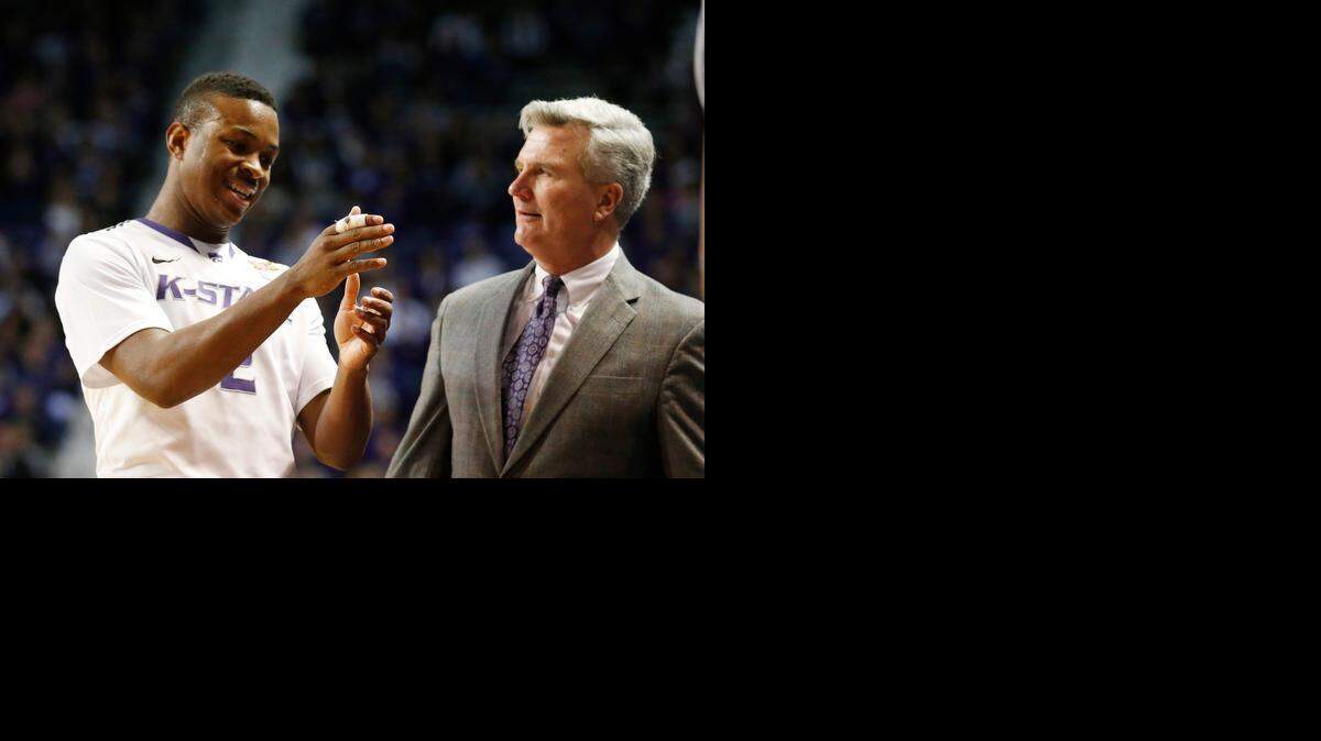 
K-State head coach Bruce Weber listens to K-State guard Marcus Foster. (January 18, 2014)
