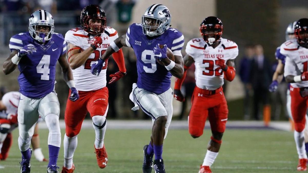K-State wide receiver Byron Pringle sprints 99 yards for a touchdown on a kick off return late in the first half Saturday night against Texas Tech, as Dominique Heath helps block (October 8, 2016)