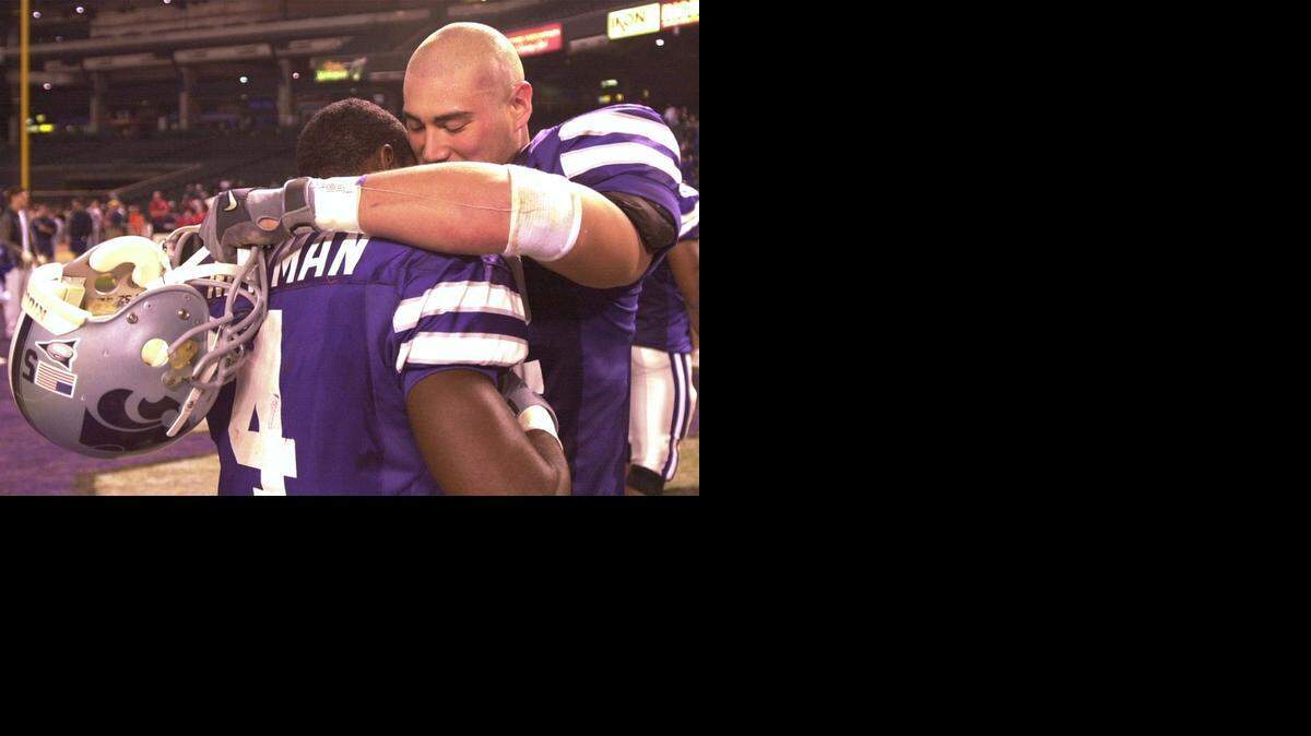
Kansas State’s Ben Leber, right, hugs teammate Terrance Newman after the Insight.com Bowl loss to Syracuse in 2001.
