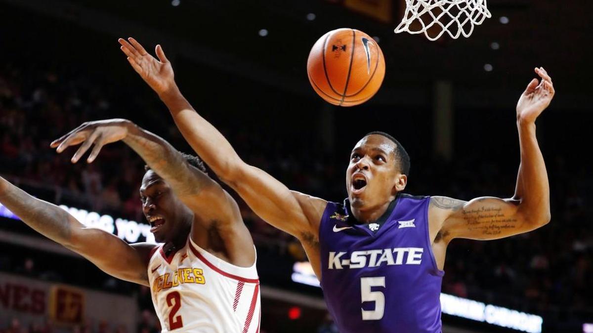 Kansas State guard Barry Brown (5) is fouled by Iowa State forward Cameron Lard (2) while driving to the basket during the first half of an NCAA college basketball game, Friday, Dec. 29, 2017, in Ames, Iowa.
