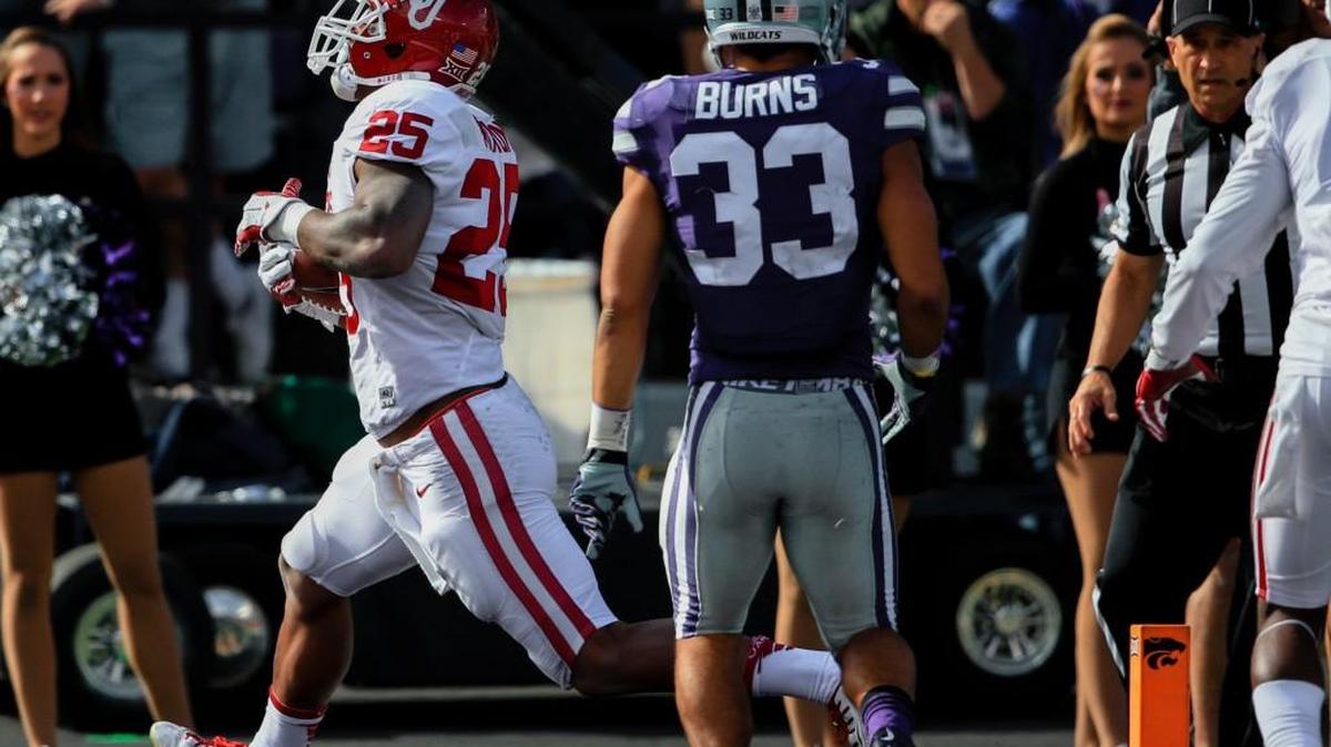 K-State defensive back Morgan Burns watches as Oklahoma running back Joe Mixon scores a touchdown in Manhattan. (AP Photo/Nati Harnik)