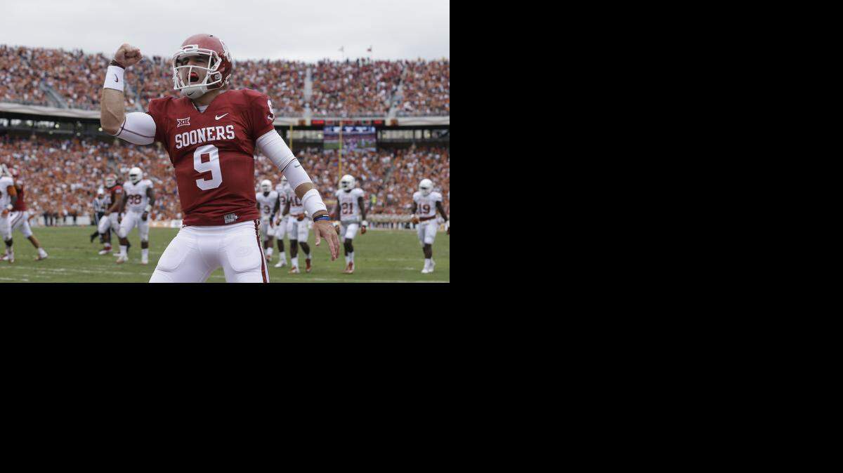
Oklahoma quarterback Trevor Knight celebrates a touchdown against Texas. 

