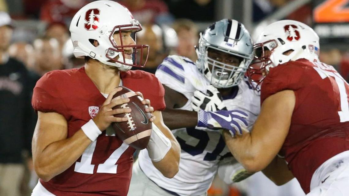 K-State defensive end Reggie Walker applies pressure to Stanford quarterback Ryan Burns.