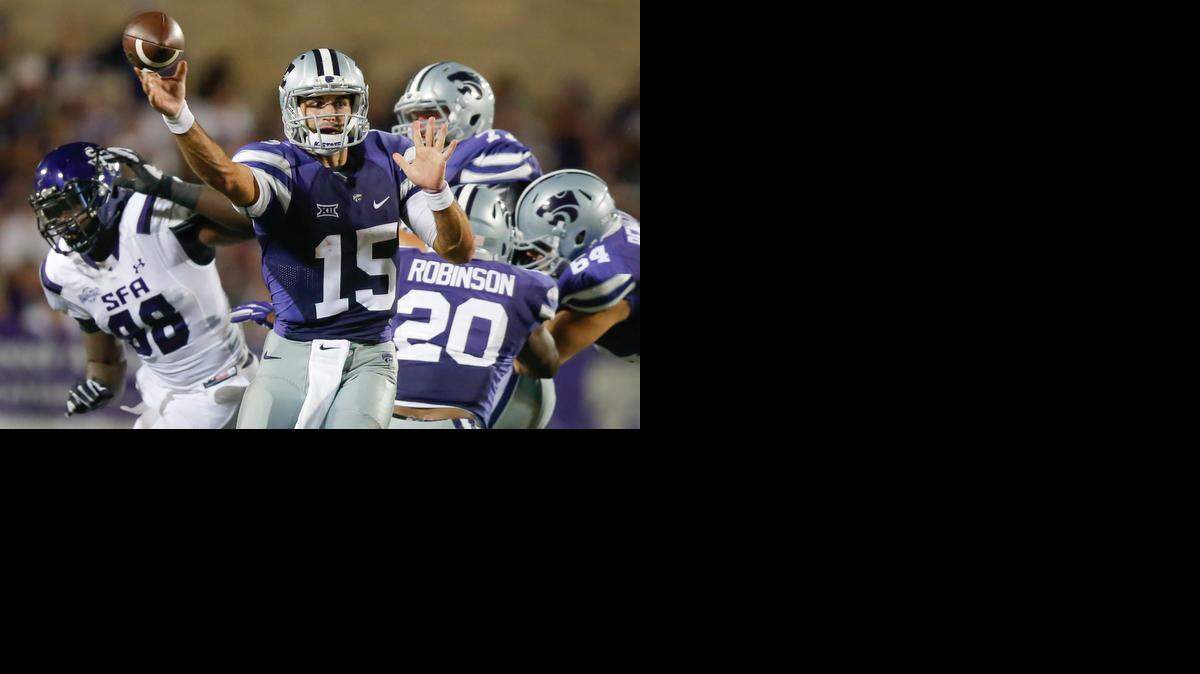 
Kansas State quarterback Jake Waters dumps off a pass against Stephen F. Austin.

