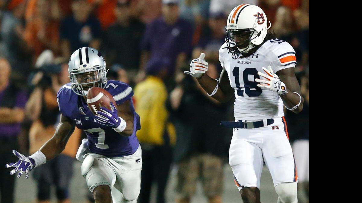 
K-State defensive back Danzel McDaniel juggles a pass intended for Auburn wide receiver Sammie Coates last September.
