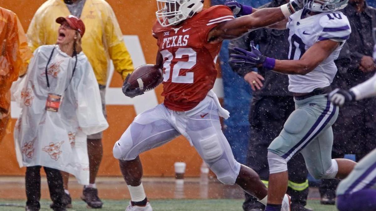 Texas running back Johnathan Gray fights off Kansas State defensive back Donnie Starks during the first half Saturday in Austin.