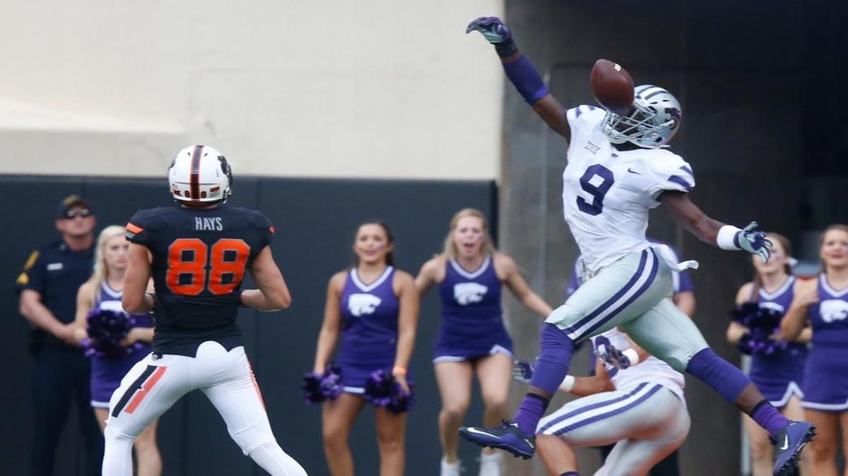 
K-State linebacker Elijah Lee swats a pass against Oklahoma State last Saturday. 
