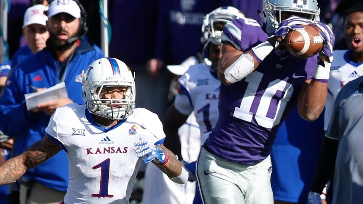 K-State defensive back Donnie Starks grabs a Kansas pass and returns it for a touchdown last Saturday in Manhattan.