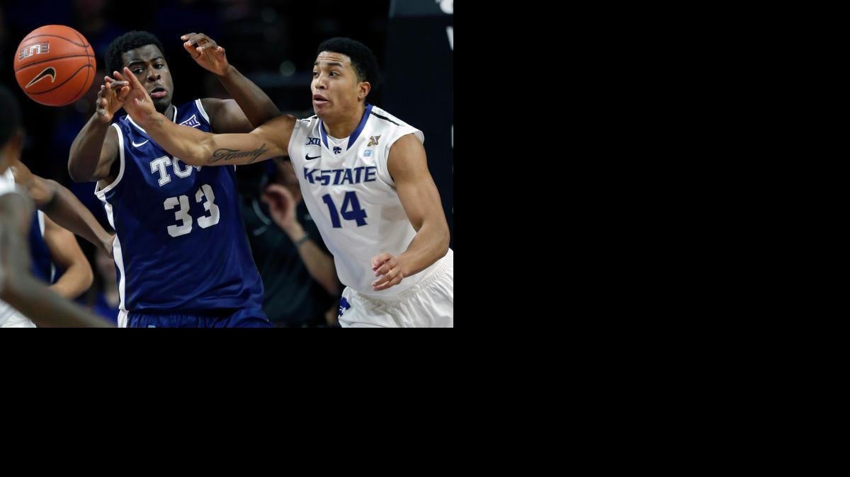 
Kansas State guard Justin Edwards (14) steals the ball from TCU forward Chris Washburn during the first half Wednesday night in Manhattan.
