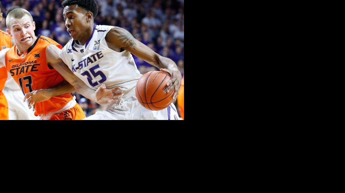 
K-State sophomore Wesley Iwundu tries to drive past Oklahoma State’s Phil Forte.(January 24, 2015)
