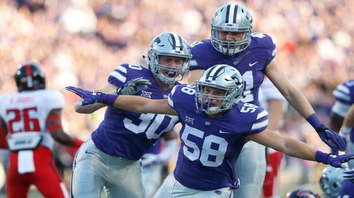 K-State linebacker Trent Tanking celebrates with defenders after a big play against Texas Tech on Oct. 8.
