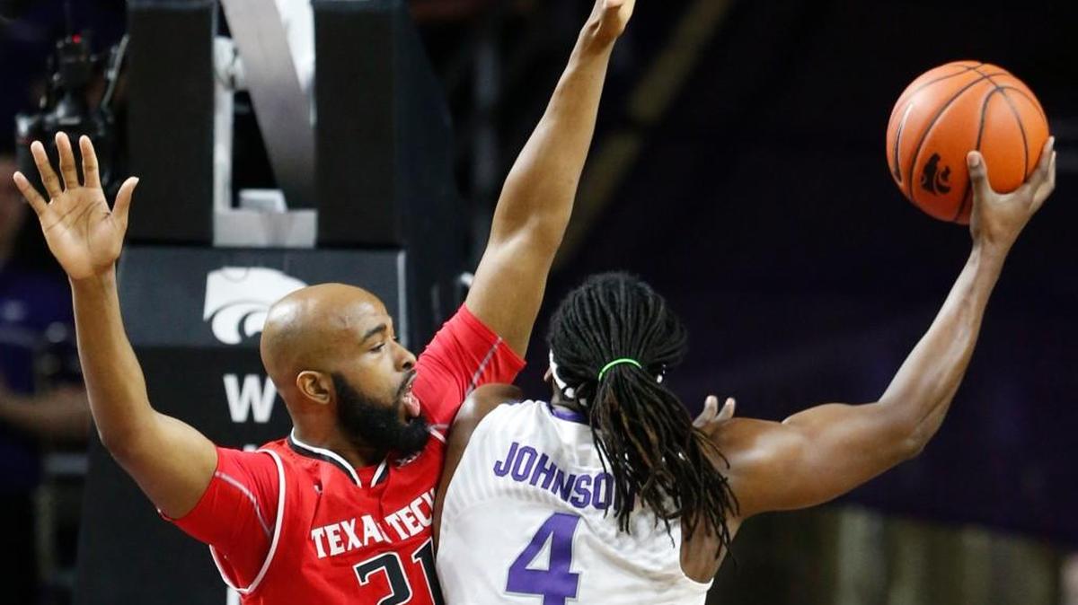 K-State forward D.J. Johnson goes up for a shot against Texas Tech forward Anthony Livingston on Saturday in Bramlage Coliseum.