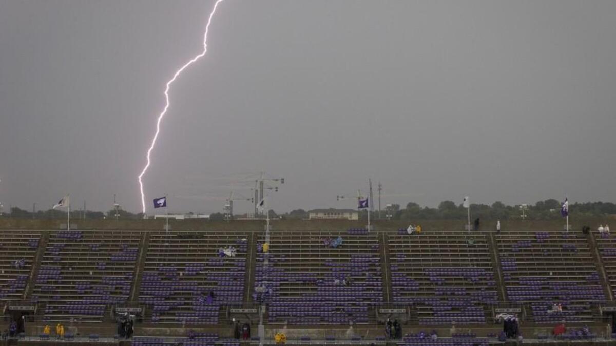 Lightning can be see to the east of Snyder Family Stadium in Manhattan on Saturday.