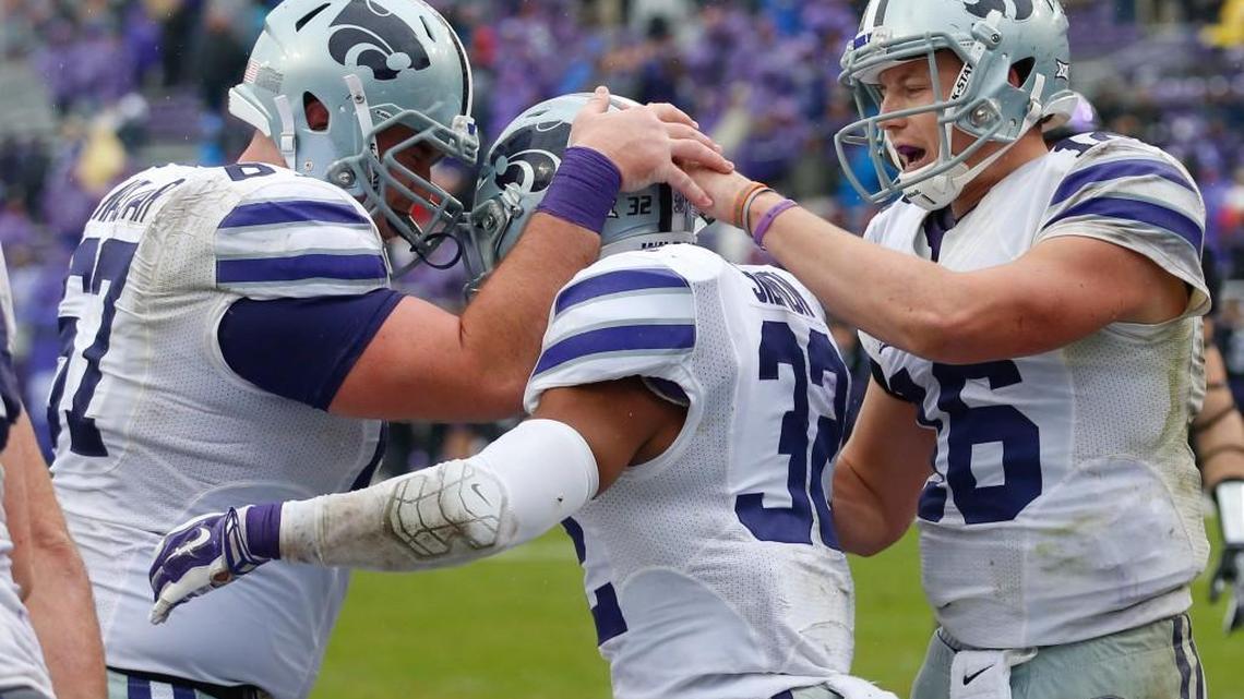 K-State offensive lineman Reid Najvar and quarterback Jesse Ertz congratulate K-State running back Justin Silmon after he scored a touchdown. (December 3, 2016)