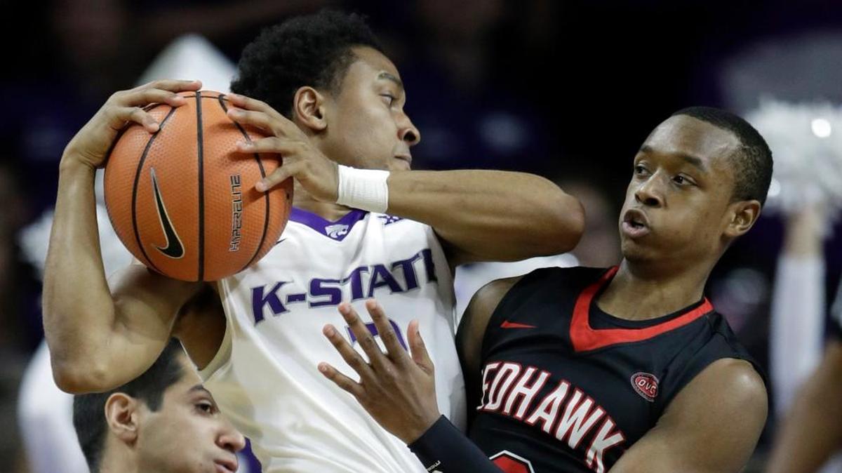 Kansas State guard Kamau Stokes, left, is covered by Southeast Missouri State guard Jonathan Dalton during the first half Saturday night in Manhattan.